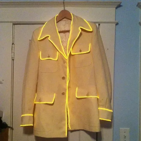 A yellow coat trimmed with glowing yellow EL wire