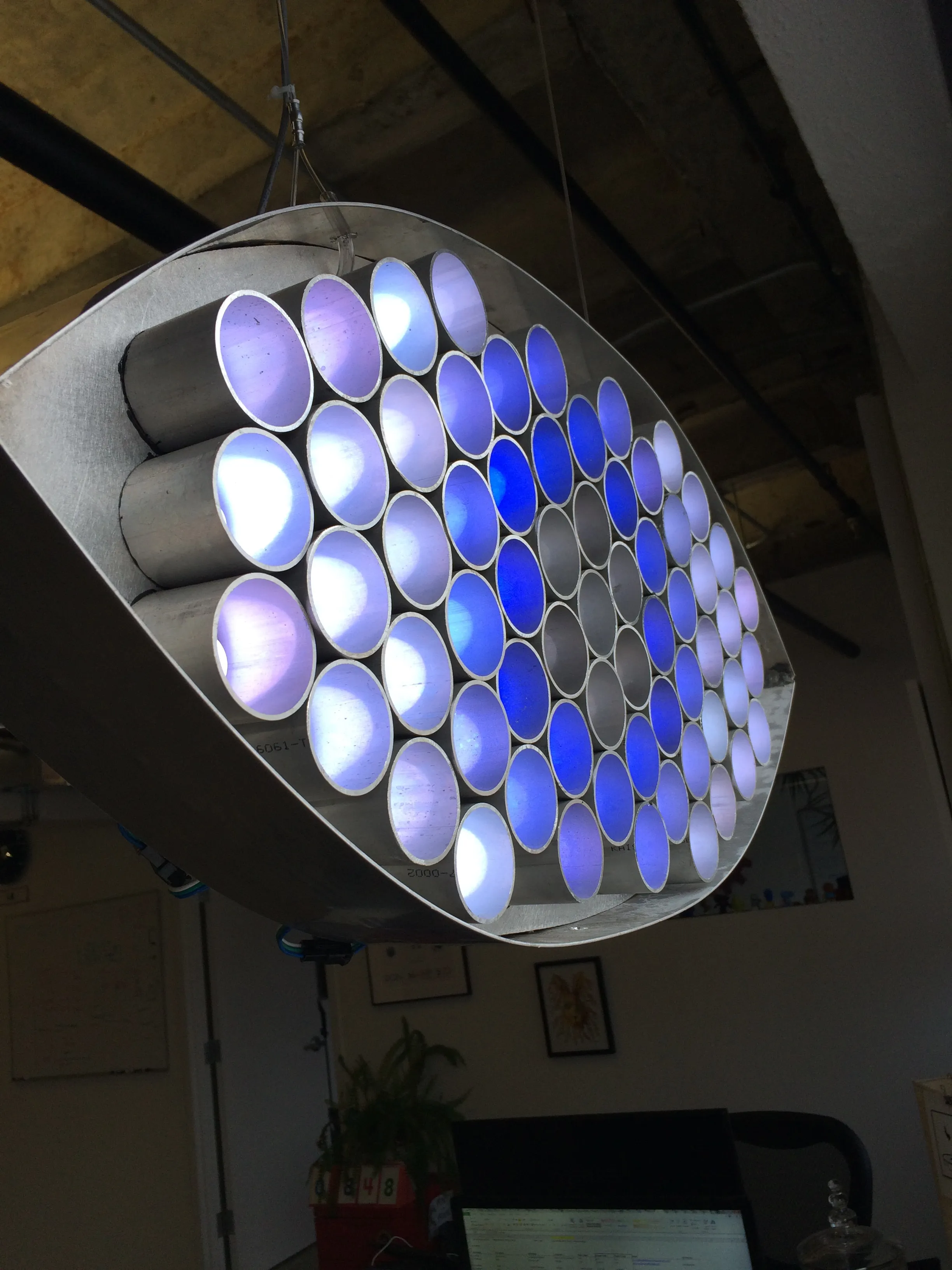 An abstract, glowing aluminum eye